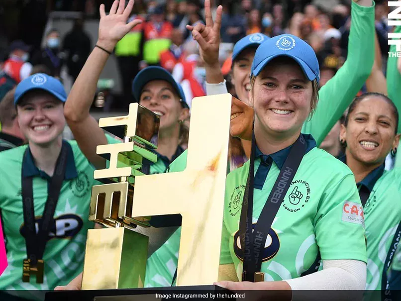 Woman holding trophy 