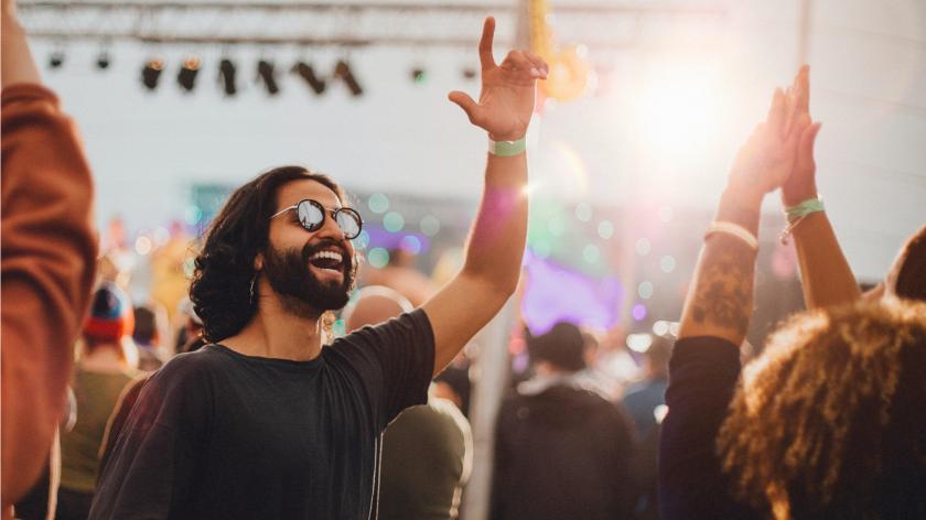 Man in sunglasses happy at a festival